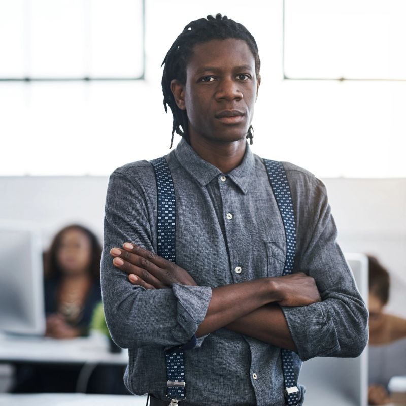 Portrait of a confident young businessman working in a modern office