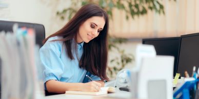 Construction project manager working on a construction schedule for her retail client.