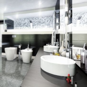 Modern bathroom with sleek fixtures and mirrored wall.