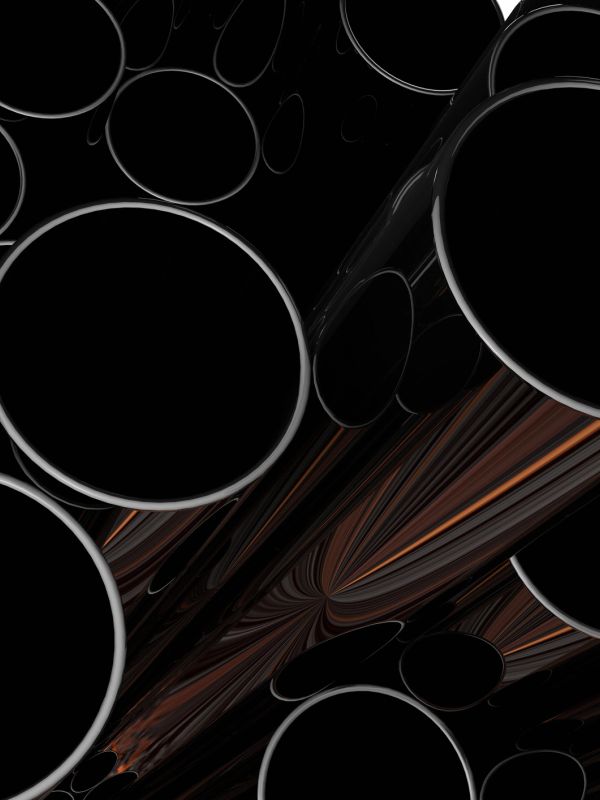 Black pipes with a glossy finish clustered together.