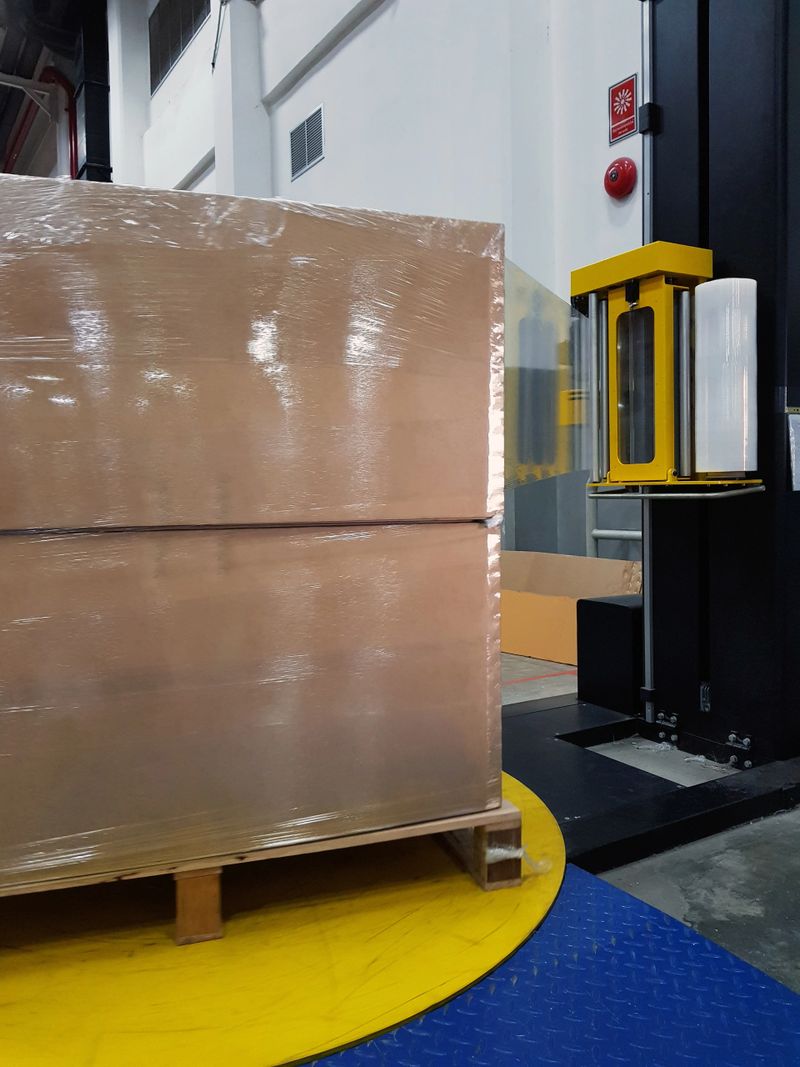 Packing accessories at workplace of industry,Semi-Automatic Stretch Wrap Machines,Wrap Machines are Best for Pallet Wrapping Jobs.