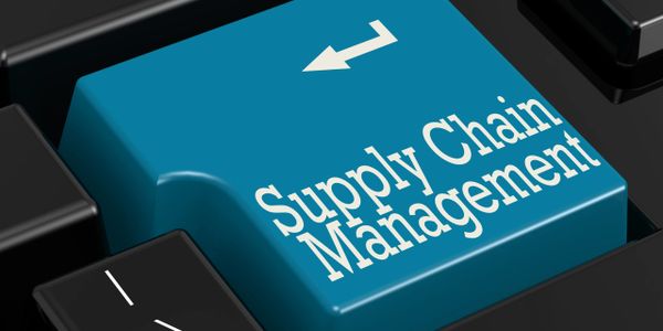 Close-up of a keyboard with a blue "Supply Chain Management" key.