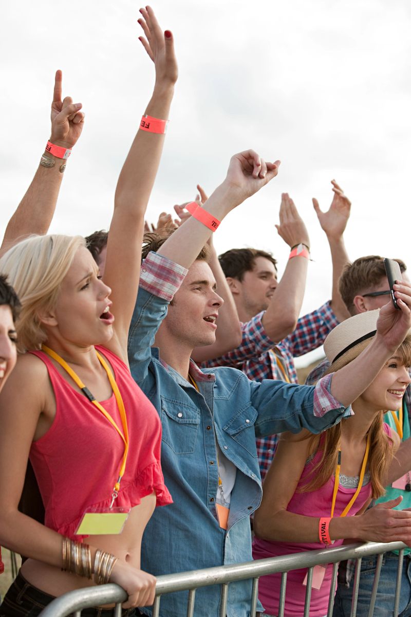 Young people cheering at festival