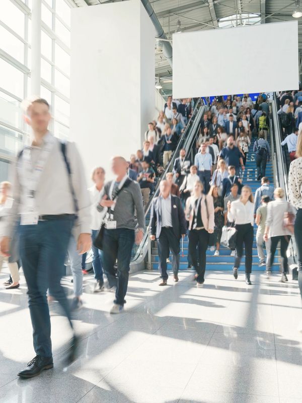 Crowd entering a large Houston event venue for conferences and corporate productions.

