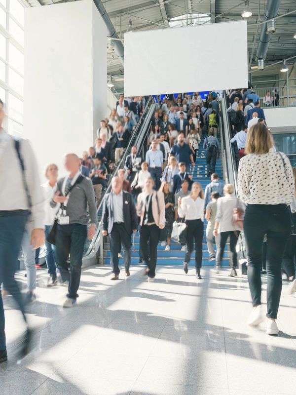 Attendees entering a Pittsburgh convention hall during a major business or trade show event.