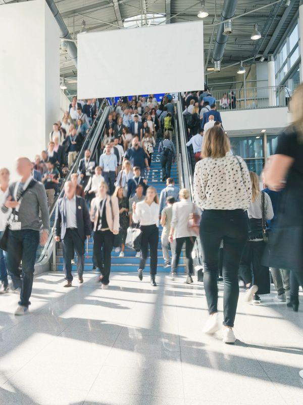 Attendees entering a Salt Lake City convention hall during a major trade show event.