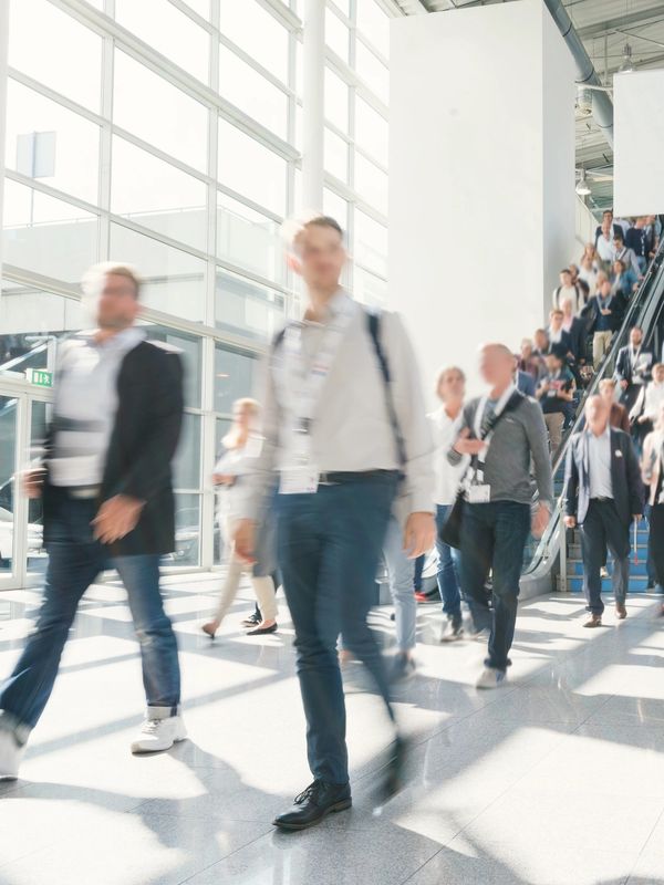 Attendees walking into a large St. Louis event venue for conferences and corporate productions.