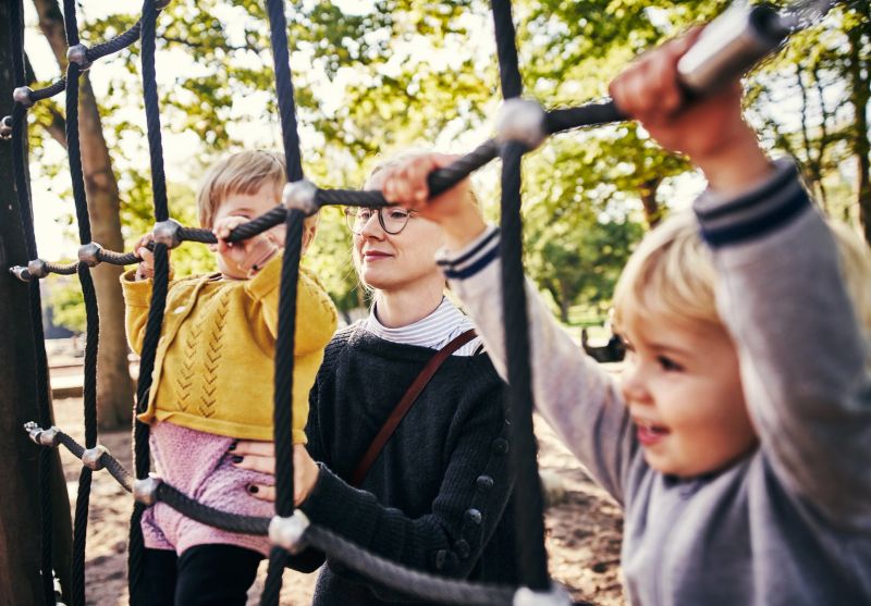 Cropped shot of a young mother and her two adorable children playing at the park