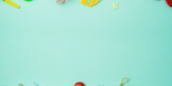 Colorful party decorations and gifts on a blue background.
