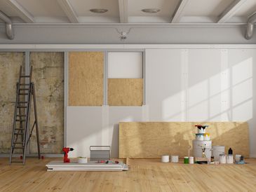 The image shows the interior of a room in the process of being renovated or constructed.