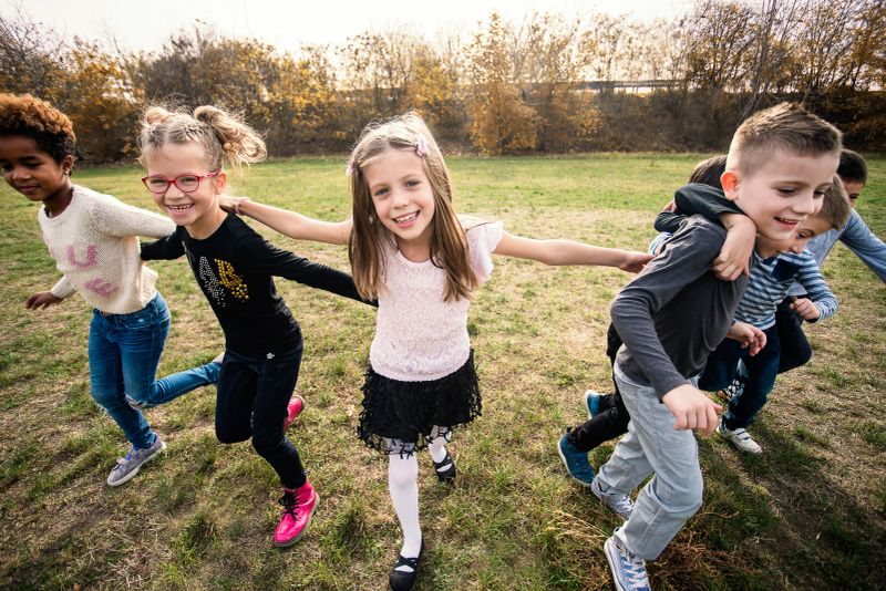Happy children playing on field