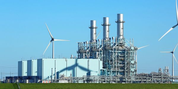 Power plant with wind turbines in clear weather.