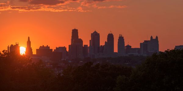 City skyline silhouette at sunset.