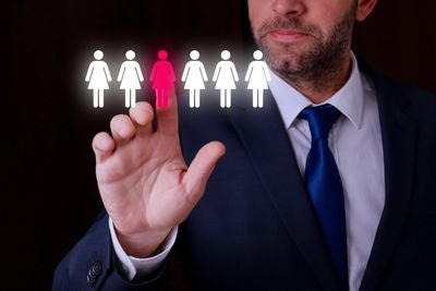 Man selecting a highlighted female icon.