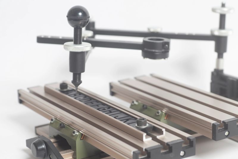 Engraving device pantograph with letterpress alphabet isolated on a white background