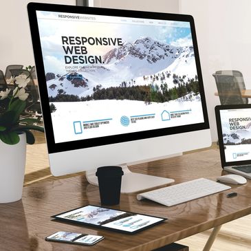 Workspace showcasing responsive web design on multiple devices.