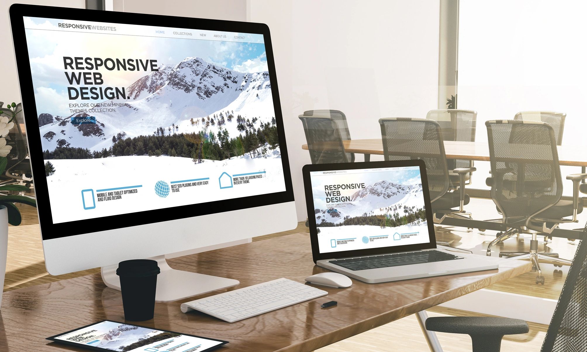Office desk showing devices displaying a campground web design layout for responsive websites