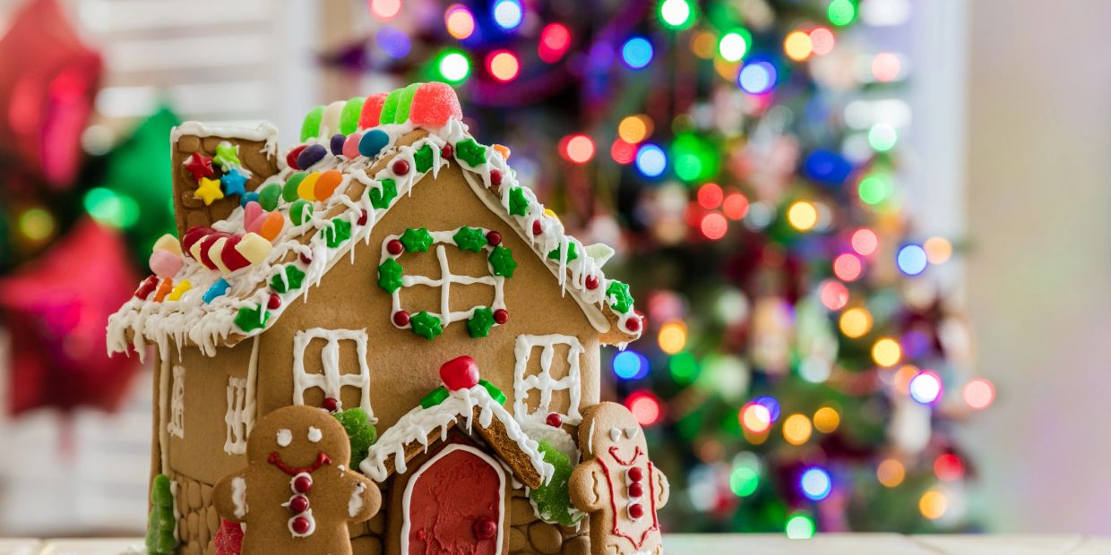 Festive gingerbread house with colorful candy decorations.