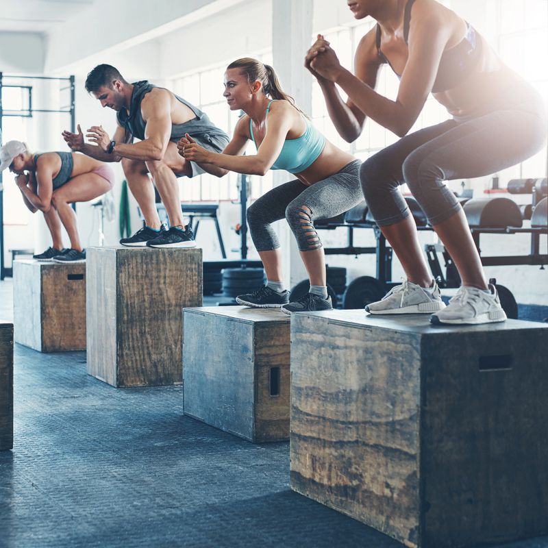 Shot of a fitness group box jumping at the gym
