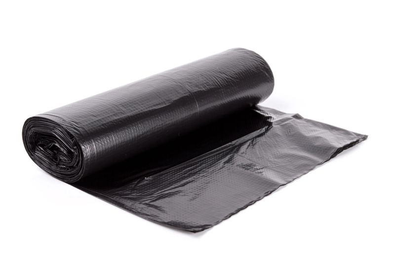 roll of plastic garbage bags isolated on white background