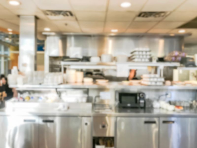 Blurred image steeliness steel cooking equipment from kitchen of breakfast restaurant in Chicago, USA