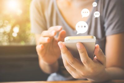 a picture of someone using social media on their phone