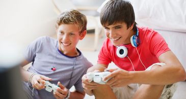 Kids in action with Nerf guns outdoors.