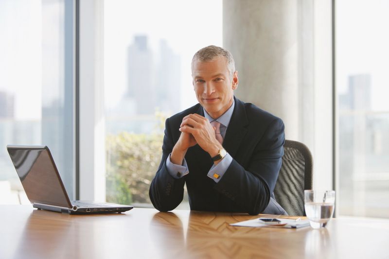 Businessman sitting at desk in office