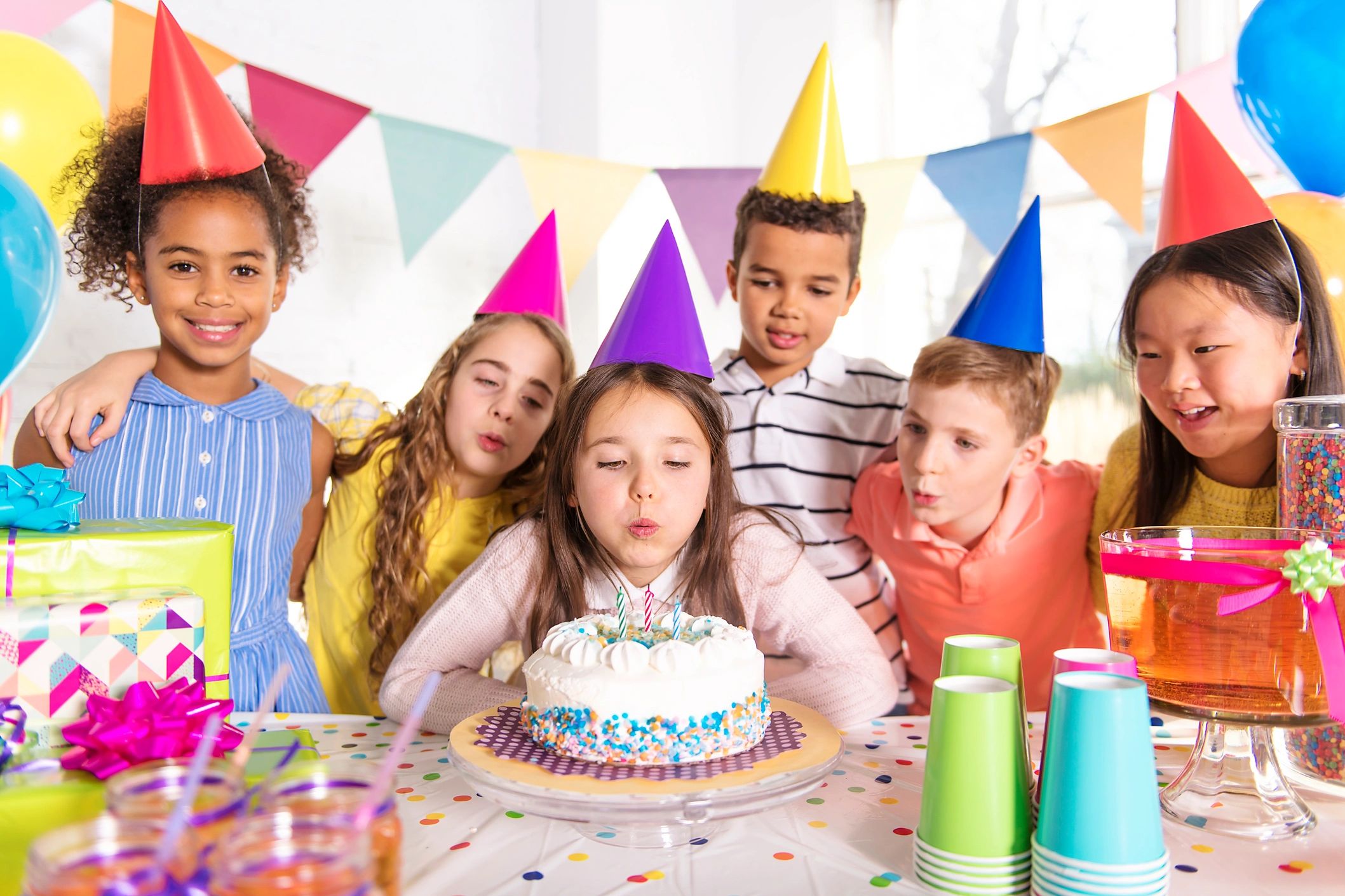Children celebrating a girl's birthday