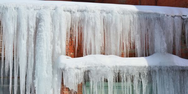 A Roof With Snow And Ice