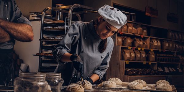 A man preparing buns