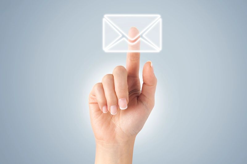 Woman hand in front of visual touch screen.