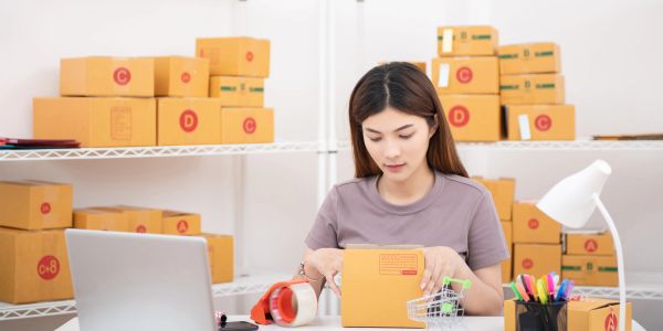Starting an online dropshipping store from home with a laptop computer.