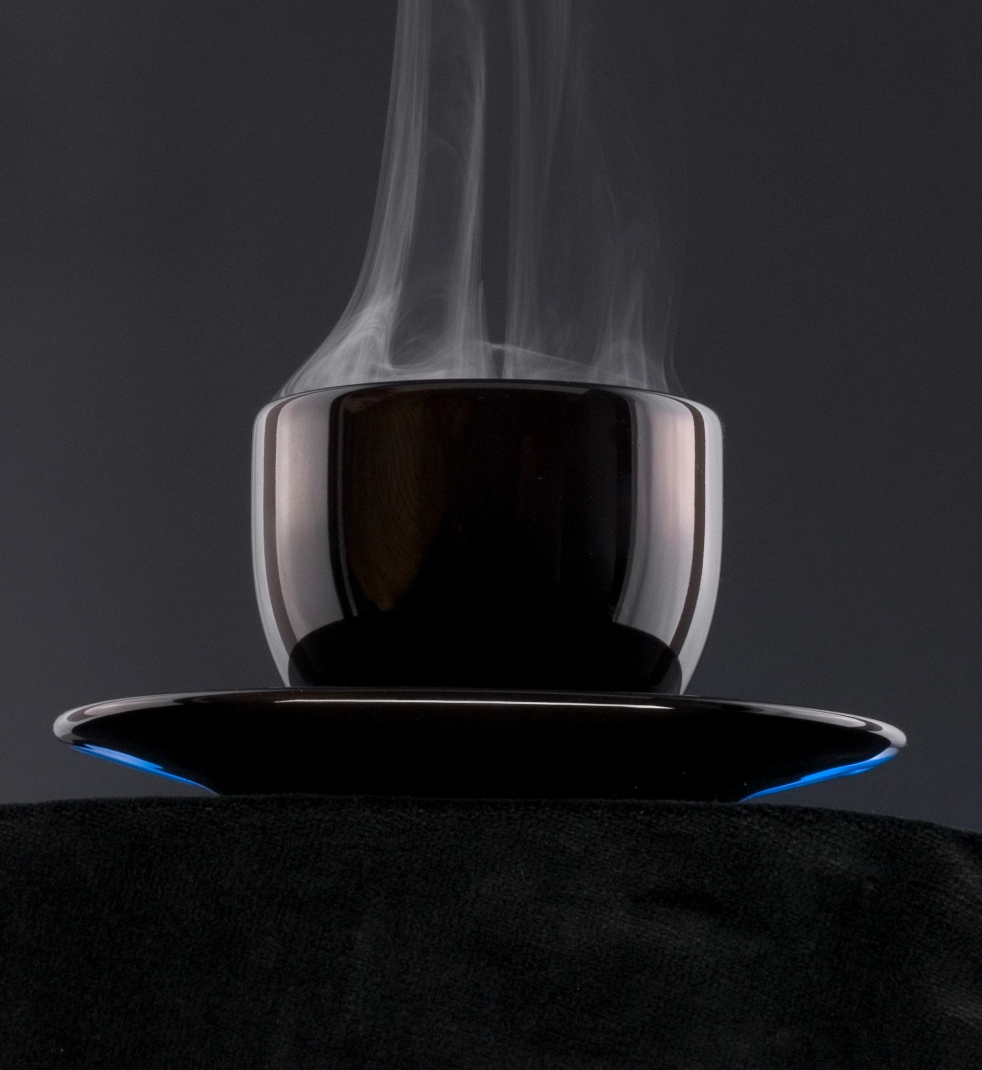 A fiery coffee cup with flames and fantasy elements.