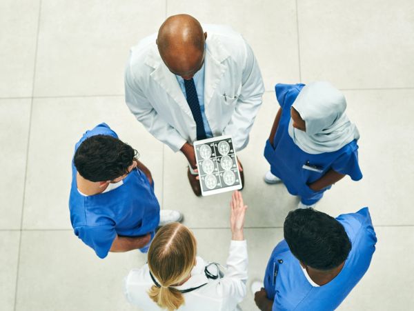 Medical team reviewing brain scans together.