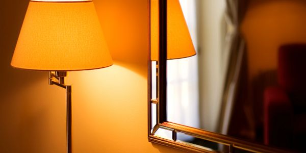 Warm light from a lamp reflecting in a mirror.