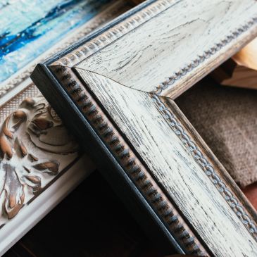 Close-up of ornate wooden picture frame corner.
