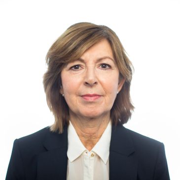 Portrait of a middle-aged woman in business attire.