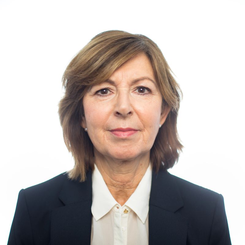 Portrait of confident senior businesswoman on white background. Senior female entrepreneur in suit staring at camera.