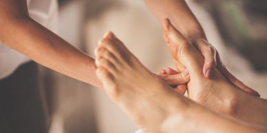 A person receiving a relaxing foot massage.