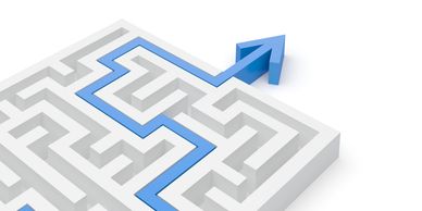 Blue arrow showing the way out of a white maze.