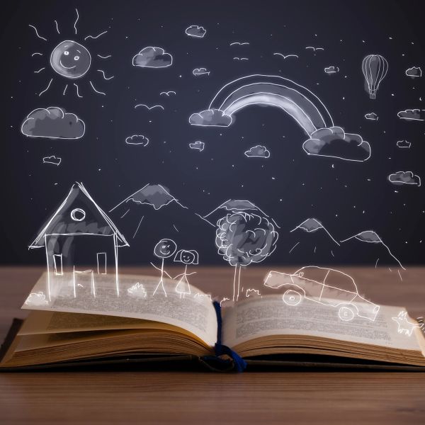 An open book with whimsical white sketches of a house, mountains, and sun above it.