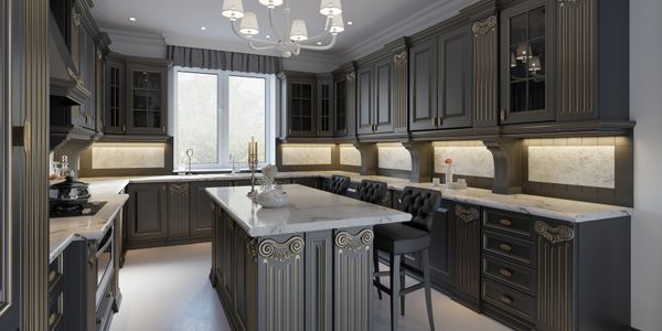 Elegant kitchen with dark cabinetry and marble countertops.