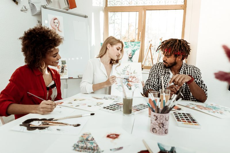 Promising artists. Three young but promising artists working in one light spacious studio together