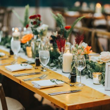 Elegant wedding table setting with flowers and candles at table 4.