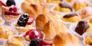 Assorted pastries with fruit and chocolate toppings