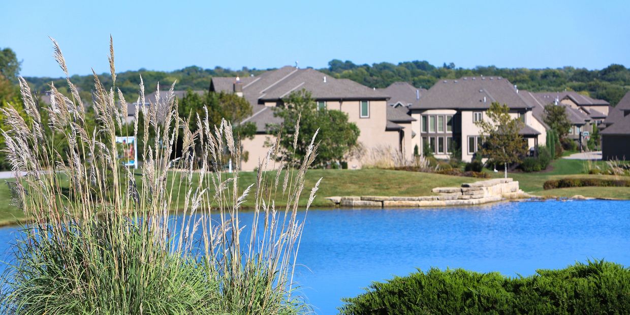 Residential homes in overland park, overlooking a pond