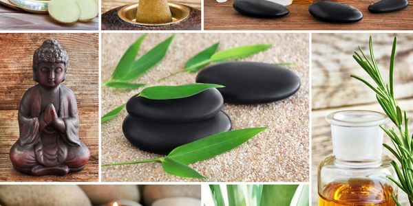 Spa elements including black stones, green leaves, and essential oils.