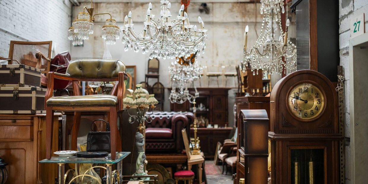 Antique furniture and chandeliers in a vintage store.