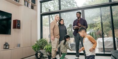 Happy family enjoying their newly renovated modern custom-built living space.
